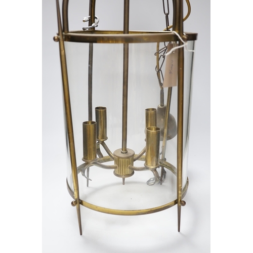 462 - A circular brass and glass four light lantern 59cm high