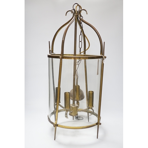 462 - A circular brass and glass four light lantern 59cm high