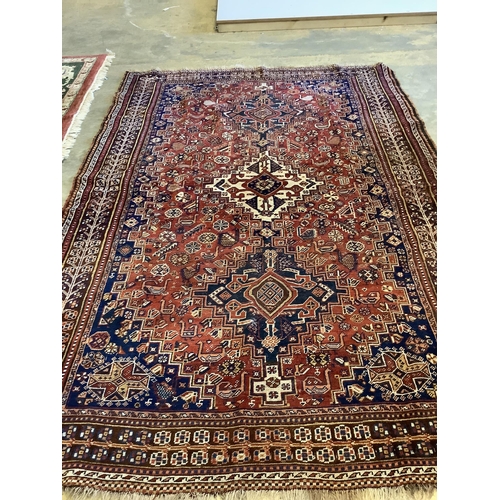 47 - An antique Qashqai red ground rug, 260 x 174cm