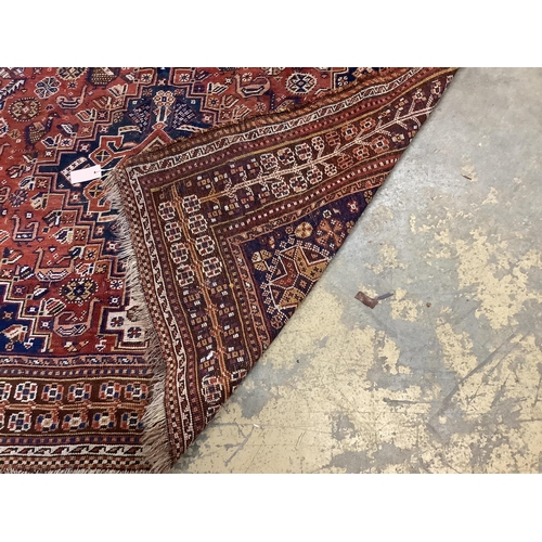 47 - An antique Qashqai red ground rug, 260 x 174cm