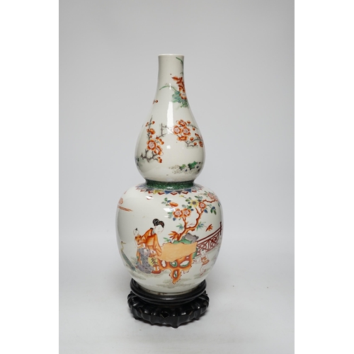 473 - A Chinese enamelled porcelain double-gourd vase on hardwood stand, 41cm total height