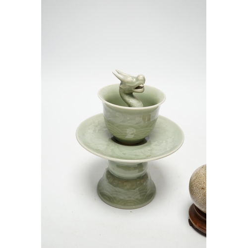 490 - A Chinese celadon glazed 'dragon' puzzle cup and stand, early 20th century and a Chinese crackle gla... 