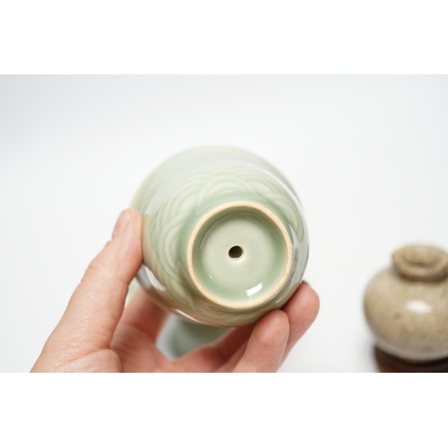 490 - A Chinese celadon glazed 'dragon' puzzle cup and stand, early 20th century and a Chinese crackle gla... 