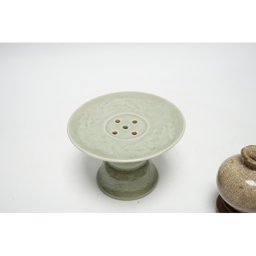 490 - A Chinese celadon glazed 'dragon' puzzle cup and stand, early 20th century and a Chinese crackle gla... 