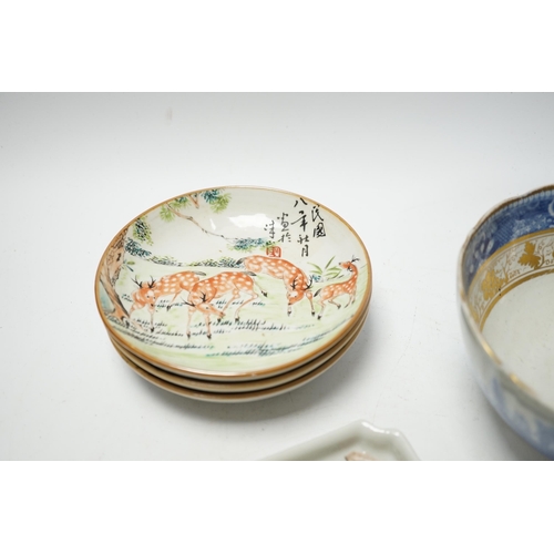 493 - Five items of Chinese tableware; a rectangular tray, three shallow dishes, and a blue and white bowl... 