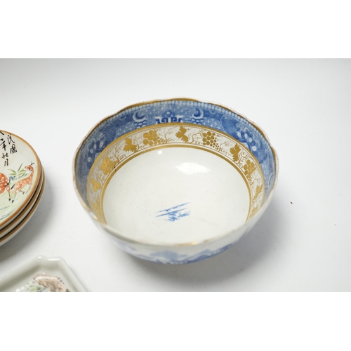 493 - Five items of Chinese tableware; a rectangular tray, three shallow dishes, and a blue and white bowl... 