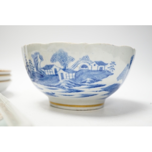 493 - Five items of Chinese tableware; a rectangular tray, three shallow dishes, and a blue and white bowl... 