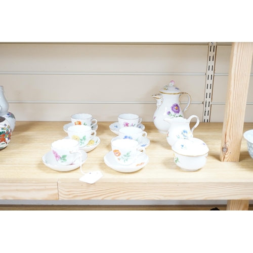 496 - A 20th century Meissen coffee set with floral decoration, comprising a coffee pot, a milk jug, a lid... 