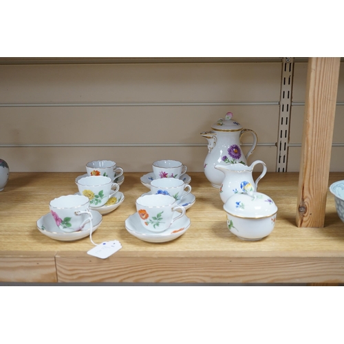 496 - A 20th century Meissen coffee set with floral decoration, comprising a coffee pot, a milk jug, a lid... 