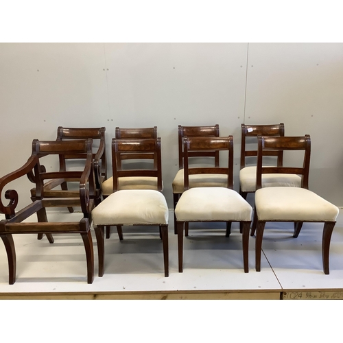 50 - A set of six Regency mahogany dining chairs and two later elbow chairs lacking upholstery