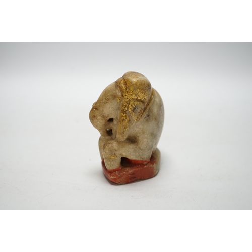 504 - An Indian carved and painted alabaster model of an elephant, 10cm tall