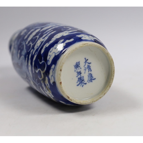 515 - A Chinese blue white dragon rouleau vase, Kangxi mark, late 19th century, 21cm high