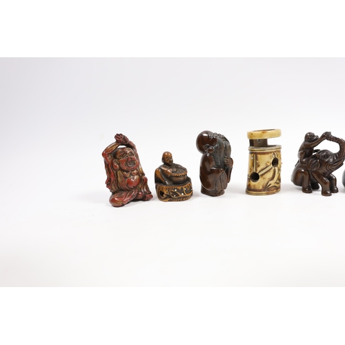 541 - A group of six Japanese netsuke in wood, staghorn and lacquer, 19th century and later