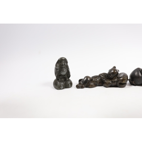 542 - Two 19th century Japanese bronze scroll weights and an antimony figure, largest 7cm