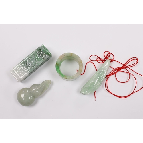 545 - Four Chinese jadeite carvings including an archers ring