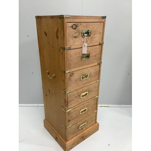 55 - A military style narrow pine six drawer chest, width 38cm, depth 39cm, height 109cm