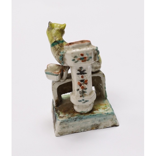 551 - An 18th century Chinese enamelled blanc de chine 'cat' joss stick holder, 7cm