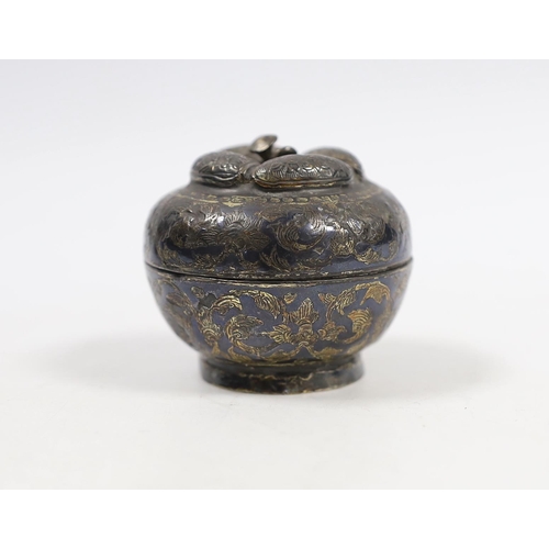 553 - An 18th/19th century Thai silver and niello betel nut box, 5cm