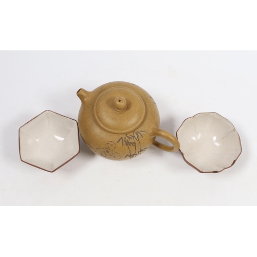 563 - A Chinese Yixing teapot, seal mark to base and two enamelled cups