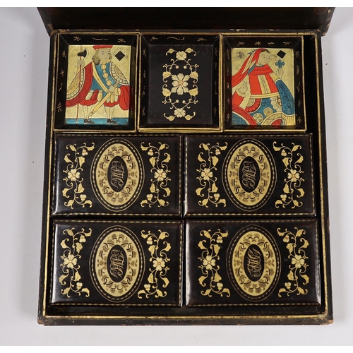 569 - A mid 19th century Chinese export lacquer games box, containing mother of pearl counters