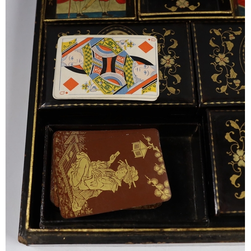 569 - A mid 19th century Chinese export lacquer games box, containing mother of pearl counters