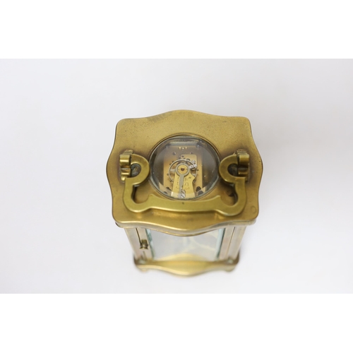 579 - A brass carriage timepiece 12cm high