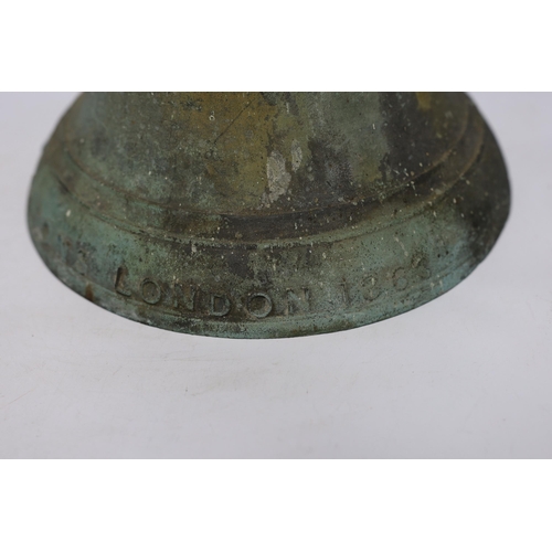 581 - A heavy bronze bell cast by J Warner & Sons, London, 1863, 29cm high