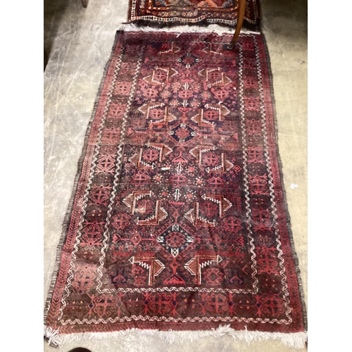 59 - A Belouch rug and a Caucasian runner, larger 260 x 100cm