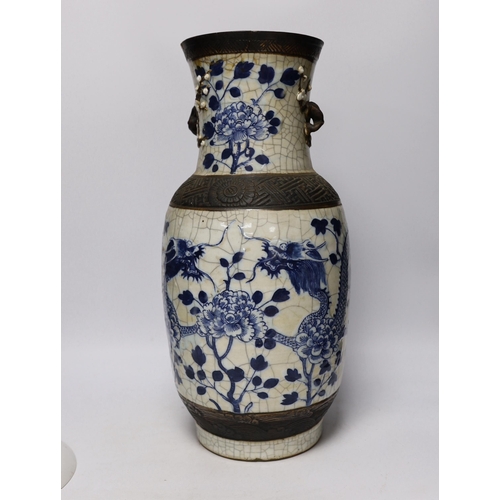 590 - A large early 20th century Chinese blue and white crackle vase and a later plate decorated with chil... 