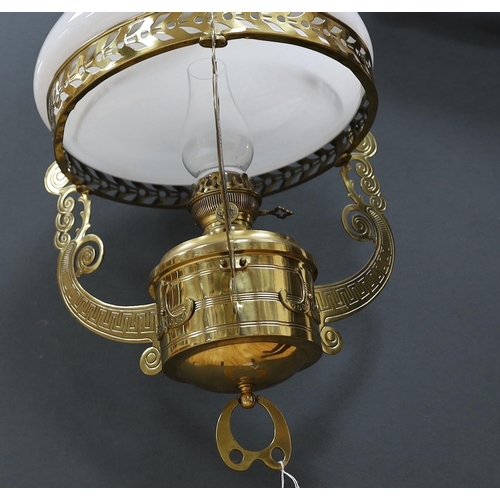 594 - A late 19th century German brass hanging lamp, with oil reservoir and opaque glass shade, approximat... 