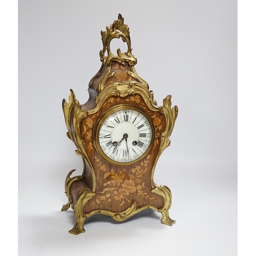 604 - A French gilt metal mounted rosewood and floral marquetry mantel clock. 40cm