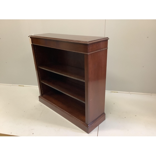 64 - A reproduction Victorian style mahogany open bookcase, width 102cm, depth 32cm, height 100cm