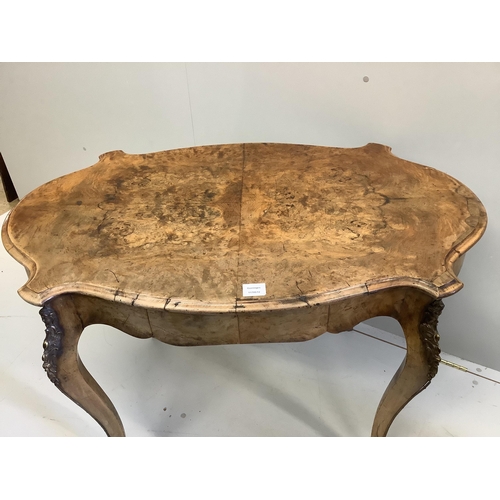 68 - A Victorian gilt metal mounted oval walnut centre table, width 106cm, depth 66cm, height 74cm