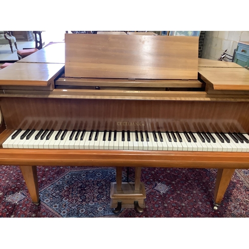 74 - A mid 20th Cecilian & Co mahogany baby grand piano retailed by Harrods Ltd