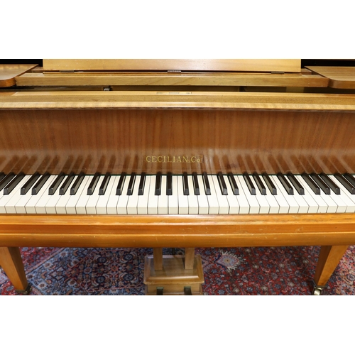 74 - A mid 20th Cecilian & Co mahogany baby grand piano retailed by Harrods Ltd