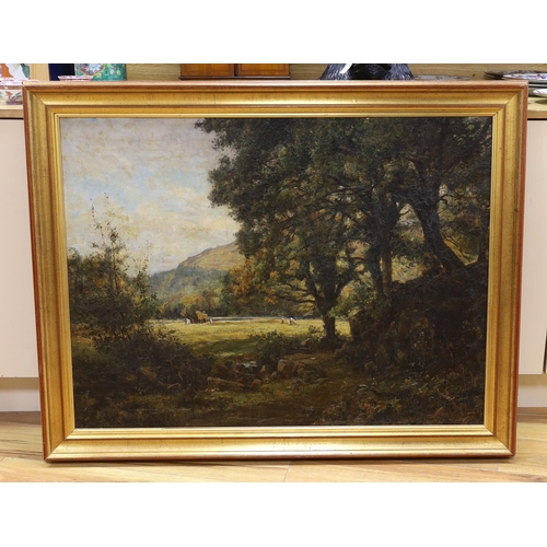 760 - Oil on canvas, Woodland before a clearing with figures hay making, indistinctly signed, possibly K G... 