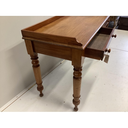 80 - A Victorian mahogany two drawer writing table, width 120cm, depth 50cm, height 76cm