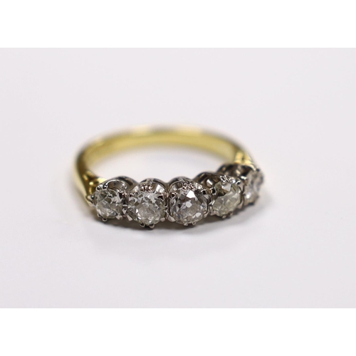 965 - A modern 18ct gold and graduated five stone diamond set half hoop ring, size M, gross weight 4.5 gra... 