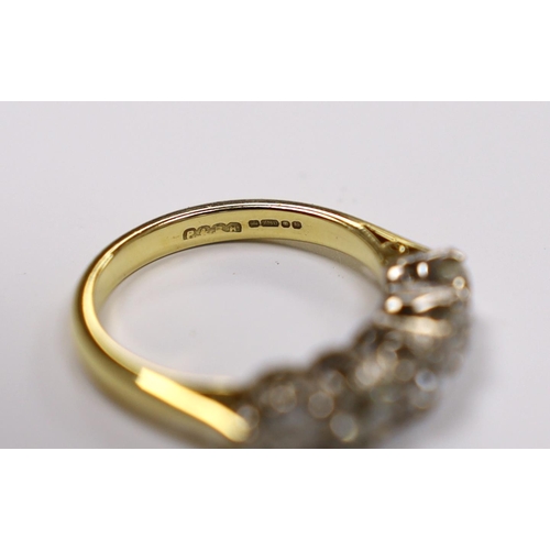 965 - A modern 18ct gold and graduated five stone diamond set half hoop ring, size M, gross weight 4.5 gra... 