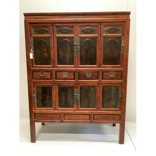 1007 - A Chinese lacquered pine side cabinet, width 134cm, depth 55cm, height 180cm