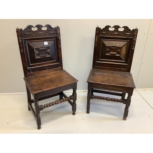 1019 - A pair of late 17th century oak wood seat chairs with moulded panelled backs, width 51cm, depth 42cm... 