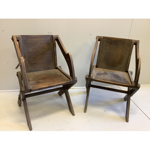 1040 - A pair of stained beech Glastonbury type chairs, width 63cm, depth 55cm, height 89cm