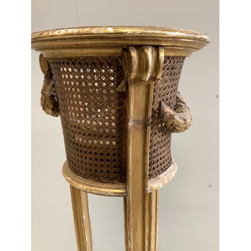 1082 - A carved giltwood and composition caned jardiniere stand, diameter 34cm, height 110cm (a.f.)