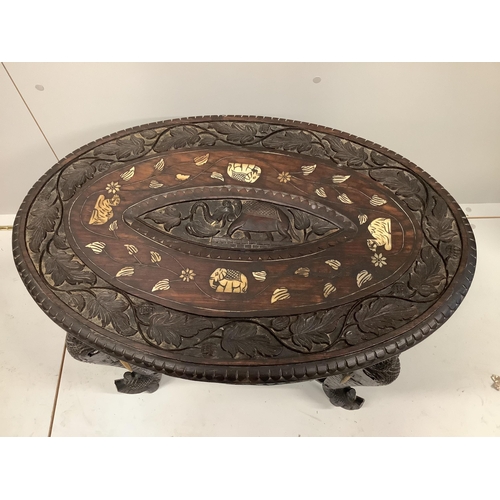 1090 - An oval Indian bone inlaid carved hardwood occasional table, width 68cm, depth 46cm, height  52cm... 