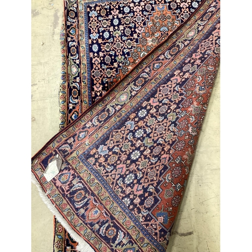 1113 - A Qashqai blue ground rug, 166 x 114cm