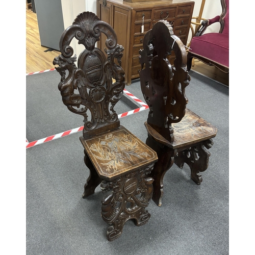 1153 - A pair of 18th century style carved walnut hall chairs, width 36cm, depth 27cm, height 106cm