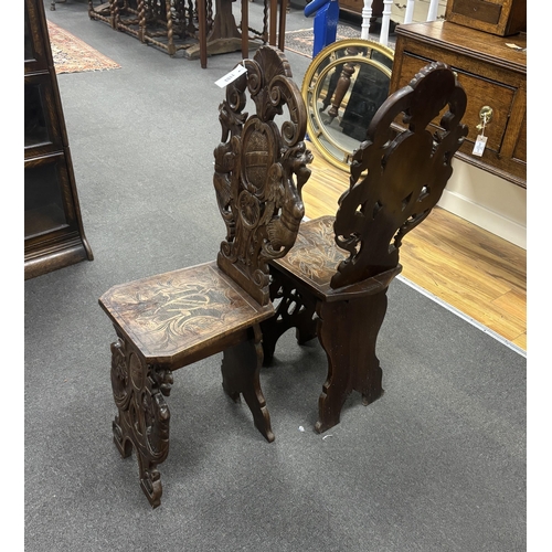 1153 - A pair of 18th century style carved walnut hall chairs, width 36cm, depth 27cm, height 106cm