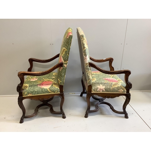 1155 - A pair of 18th century style French walnut elbow chairs, width 70cm, depth 60cm, height 116cm