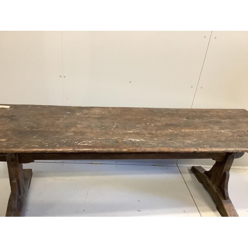 1156 - An 18th century and later rectangular oak plank top refectory table, length 226cm, depth 66cm, heigh... 