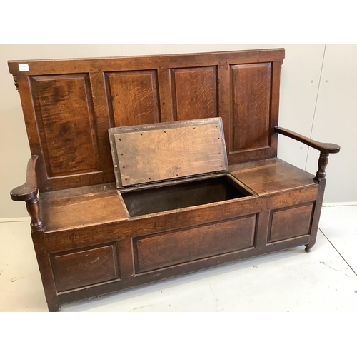 1166 - An 18th century panelled oak box seat settle, width 153cm, depth 51cm, height 108cm